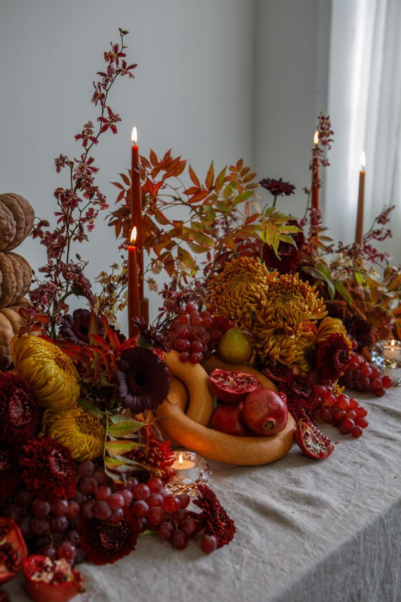 Fruit tablescape with seasonal flowers