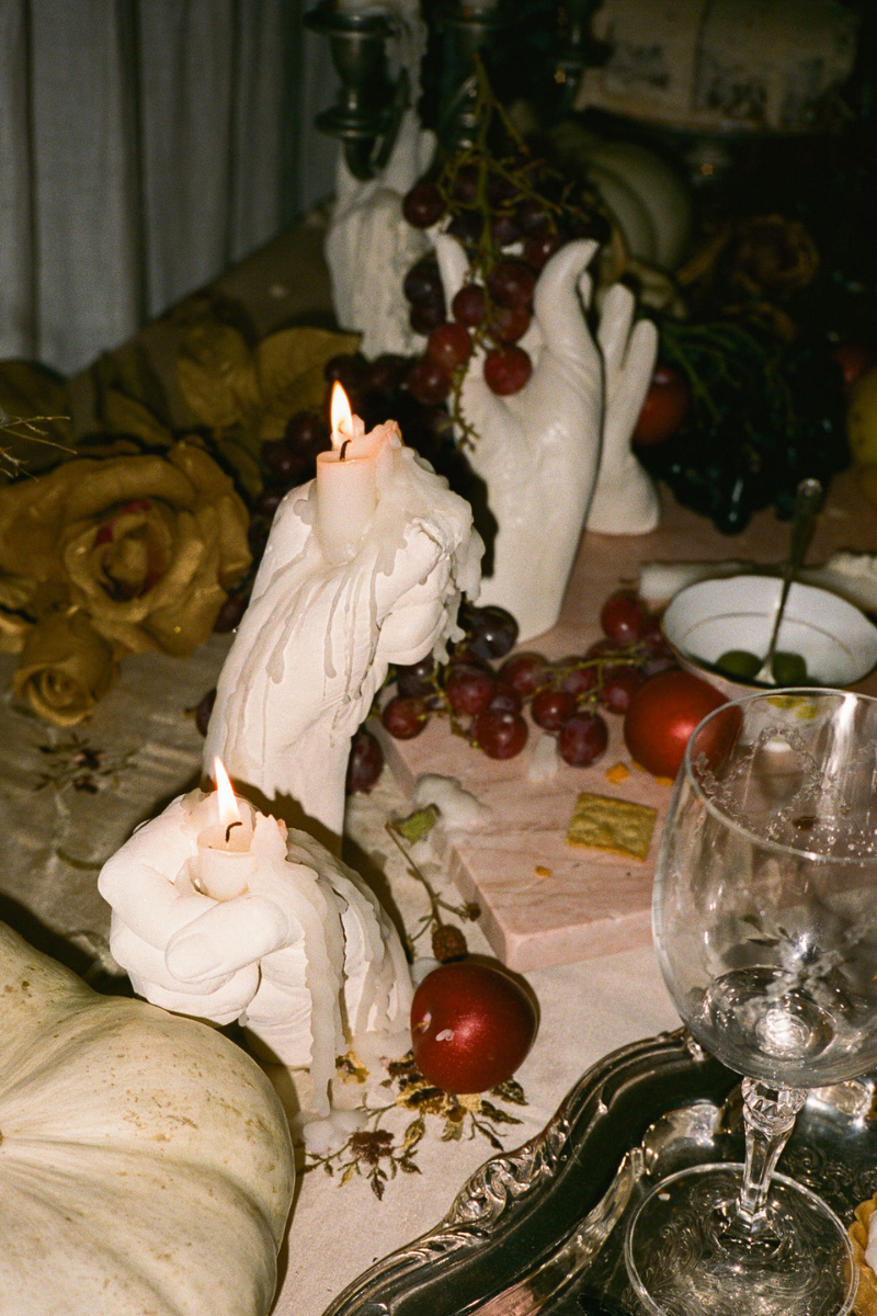Hand-shaped candle holders used in this viral tablescape are vintage