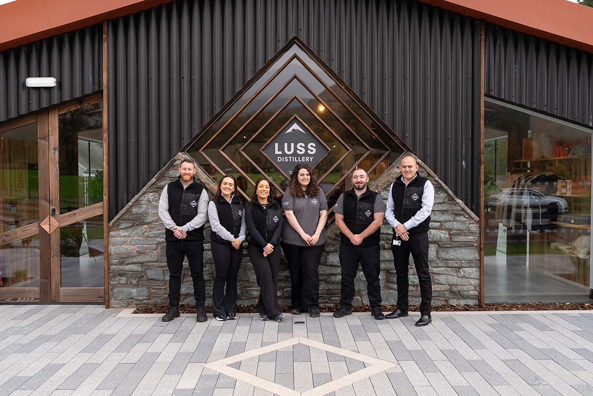 the team standing outside at Luss Distillery