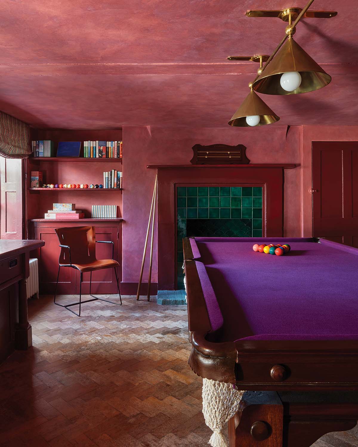 bright games room with purple pool table and purple washed walls