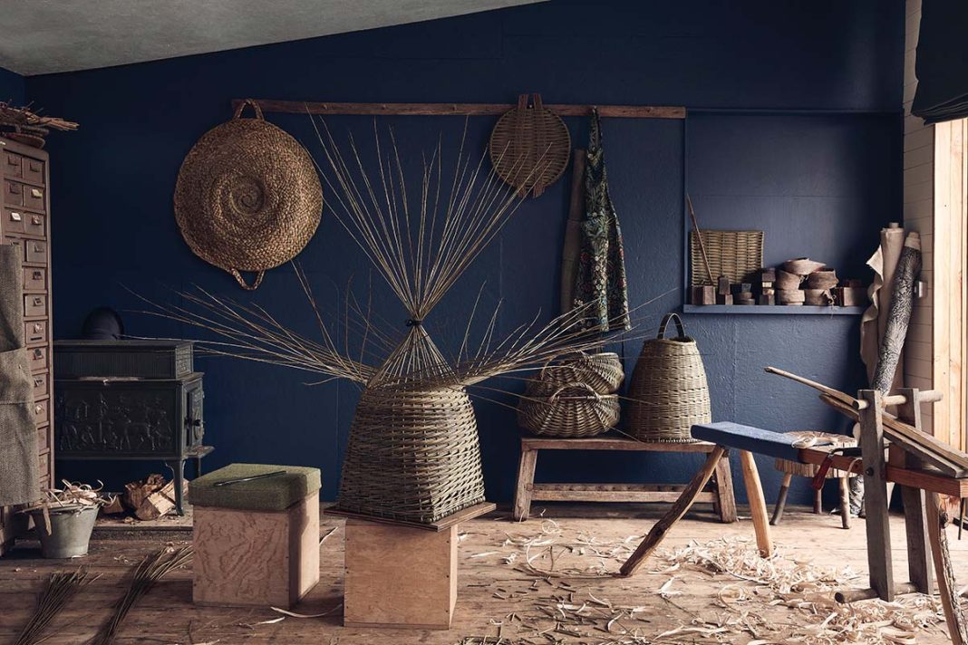 Studio Amos hobby room with blue walls and woven basket focal points