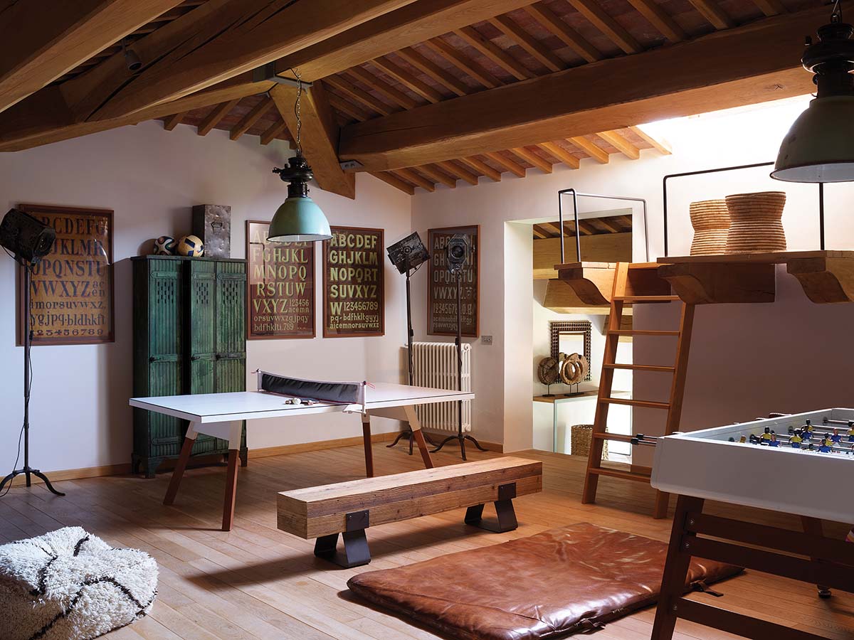 rustic games room with a boho interior and pops of green